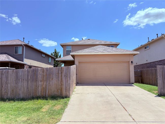 Garage featuring concrete driveway | Image 22