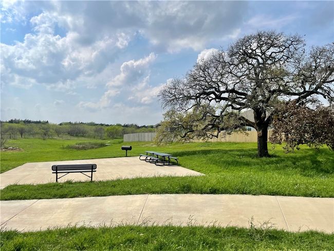 View of community featuring a yard | Image 20
