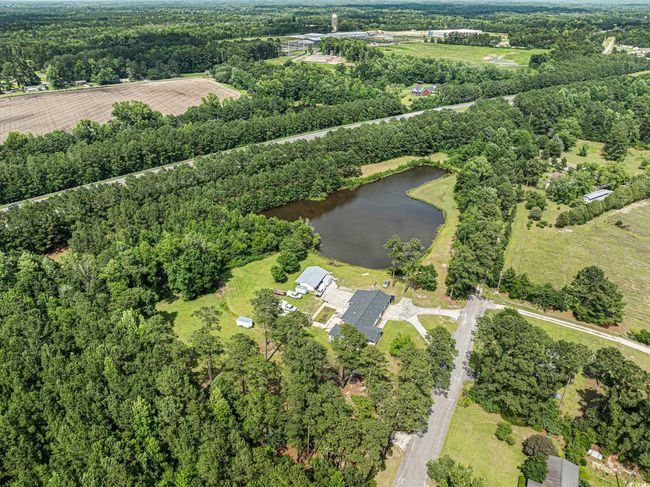 Aerial view of property and surrounding area with a nearby body of water | Image 34