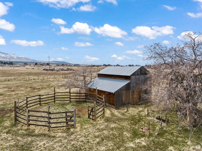 View of acreage with a mountain view, the barn and round coral | Image 74
