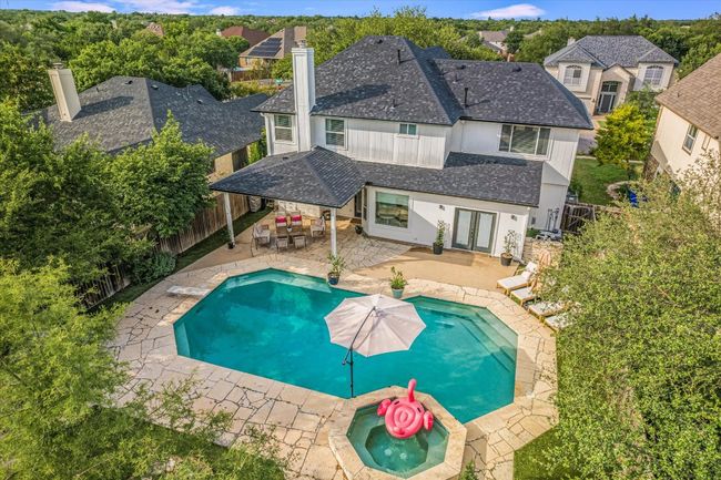 View of swimming pool featuring french doors, an in-ground hot tub, a fenced backyard, and a patio area | Image 36