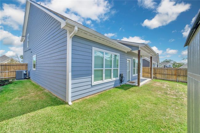 Rear view of house with a fenced backyard | Image 34