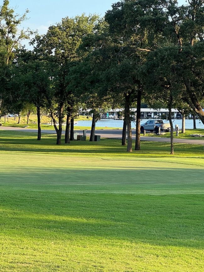 View of home's community featuring a lawn and golf course view | Image 8