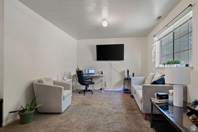 Office space with carpet floors and a textured ceiling | Image 33