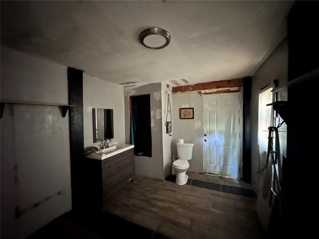Bathroom with toilet and vanity | Image 9
