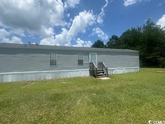 Back of house featuring a lawn | Image 18