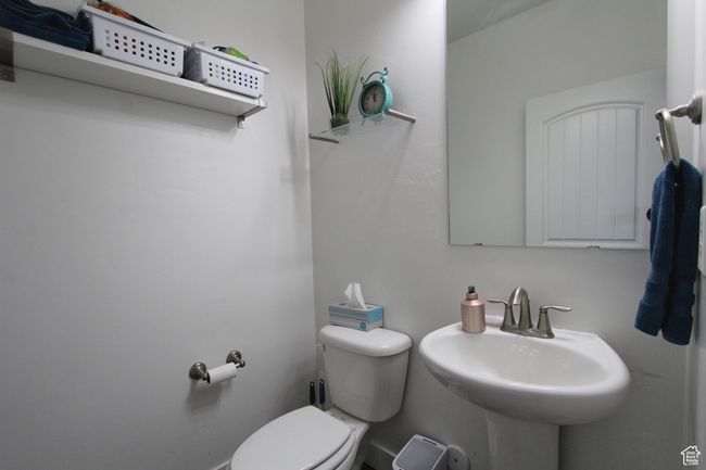 Half bath featuring toilet and a sink | Image 26