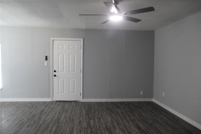 Looking to front door from the hallway. | Image 10