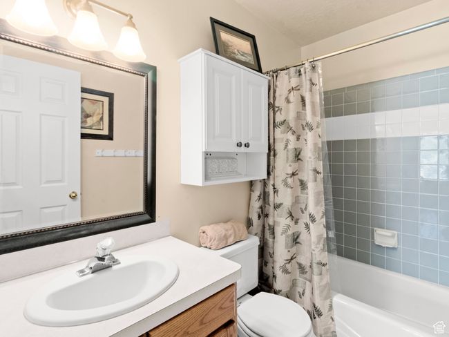 Bathroom featuring shower / bath combo | Image 12