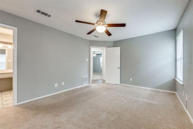 Unfurnished bedroom featuring carpet flooring and multiple windows | Image 7