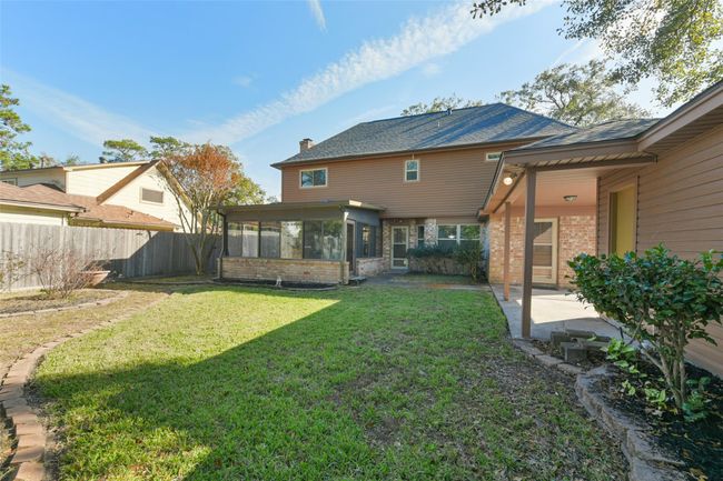 Covered patio area to the 2 car garage | Image 43