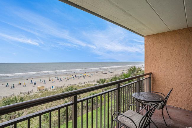 Balcony with view of water and beach | Image 15