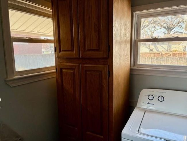Laundry area featuring washer / clothes dryer and laundry area | Image 20