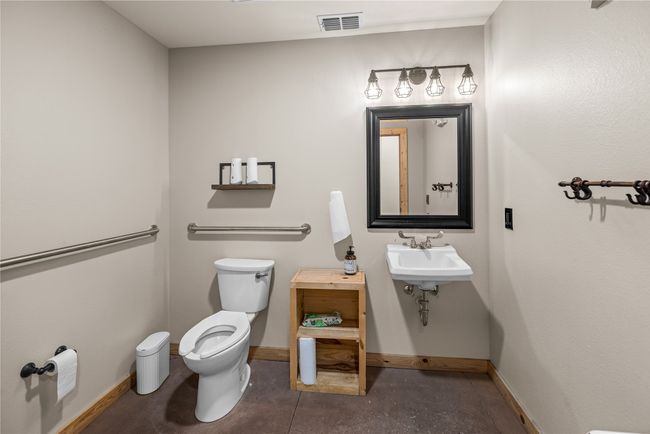 Bathroom with toilet and baseboards | Image 23