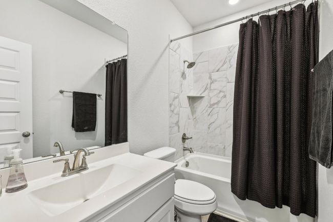 Unwind in your luxurious spa-like bathroom with dual vanities and ample storage. | Image 23