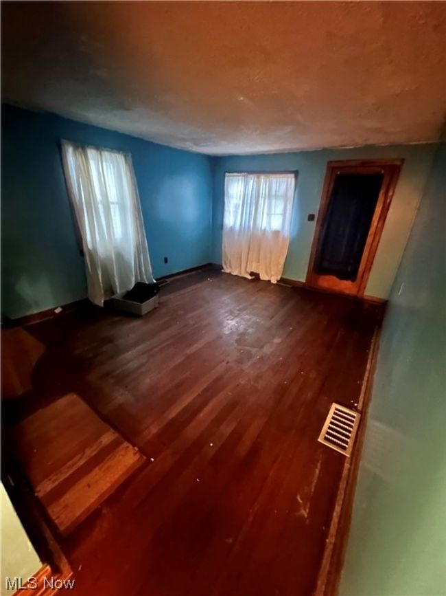 Empty room featuring dark wood-type flooring | Image 16