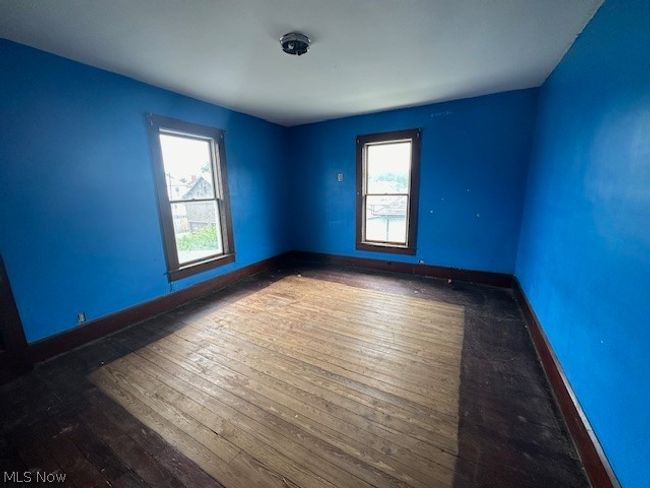 Empty room featuring dark wood-type flooring | Image 12