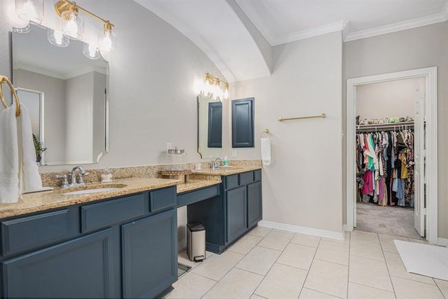 Vanity area and counter space in the primary bathroom | Image 23