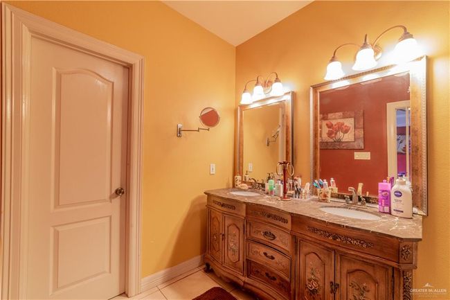 Bathroom featuring vanity and tile patterned flooring | Image 24