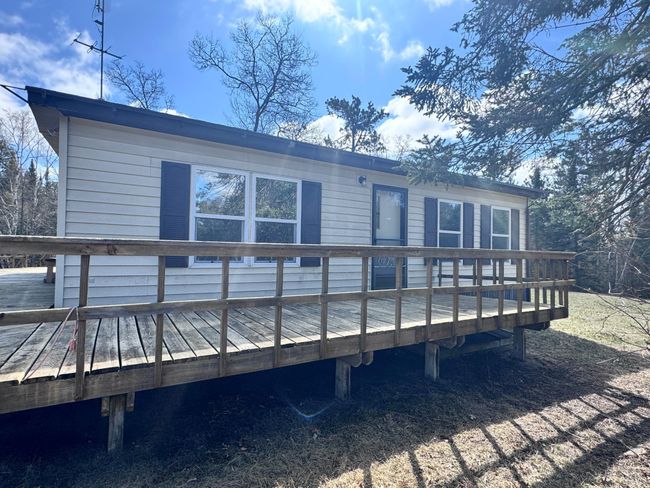 The single door leads out to the deck facing Wildwood Rd | Image 22