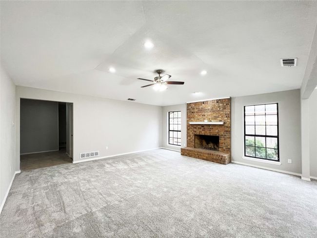 Fireplace, raised ceiling and lighted ceiling fan | Image 4