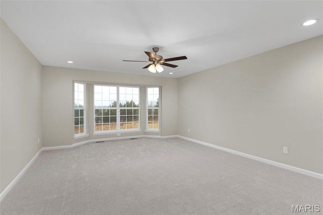 Spare room with a ceiling fan, baseboards, light carpet, and recessed lighting | Image 18