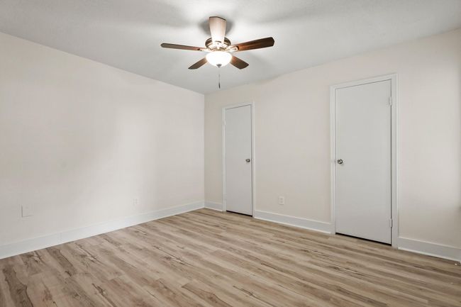 The last secondary bedrooms is located at the back of the home and features an extra long walk in closet for all your storage needs. | Image 11