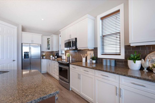 64 Windgate Close Sw, House other with 4 bedrooms, 3 bathrooms and 4 parking in Airdrie AB | Image 5