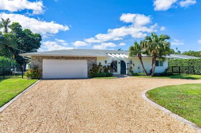 7711 W Lake Drive, House other with 4 bedrooms, 2 bathrooms and null parking in Lake Clarke Shores FL | Image 2