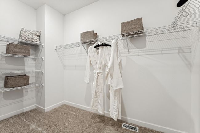 Photo is of the actual model. The primary bedroom also features an incredible walk-in closet. | Image 11