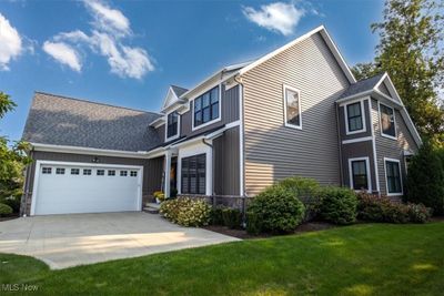 View of front of property with a garage and a front yard | Image 2