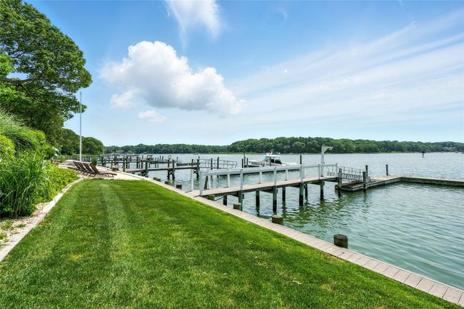 Dock featuring a yard and a water view | Image 8
