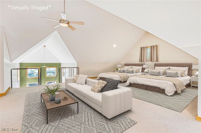 Carpeted bedroom featuring vaulted ceiling and a ceiling fan | Image 32