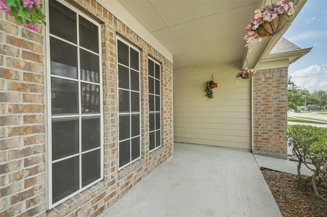 A covered front porch enhances this home's attractive appeal. | Image 4
