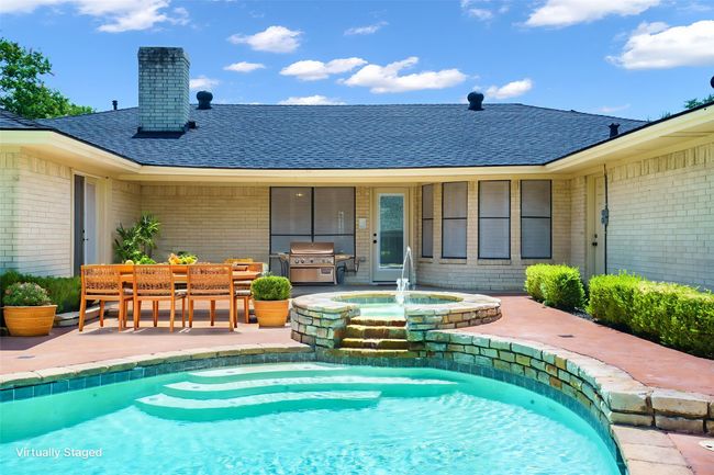 View of swimming pool with a patio area, a grill, and a pool | Image 28