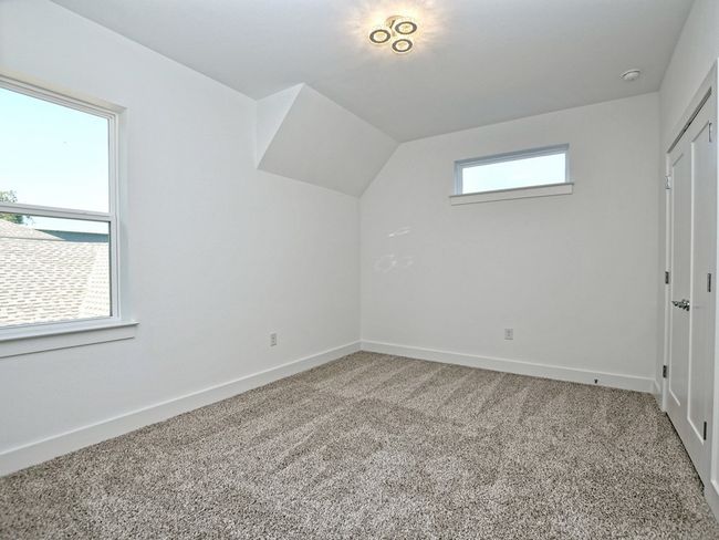 Additional living space with carpet floors and lofted ceiling | Image 24