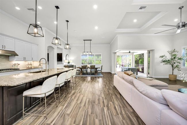view from the hallway of open concept living | Image 15