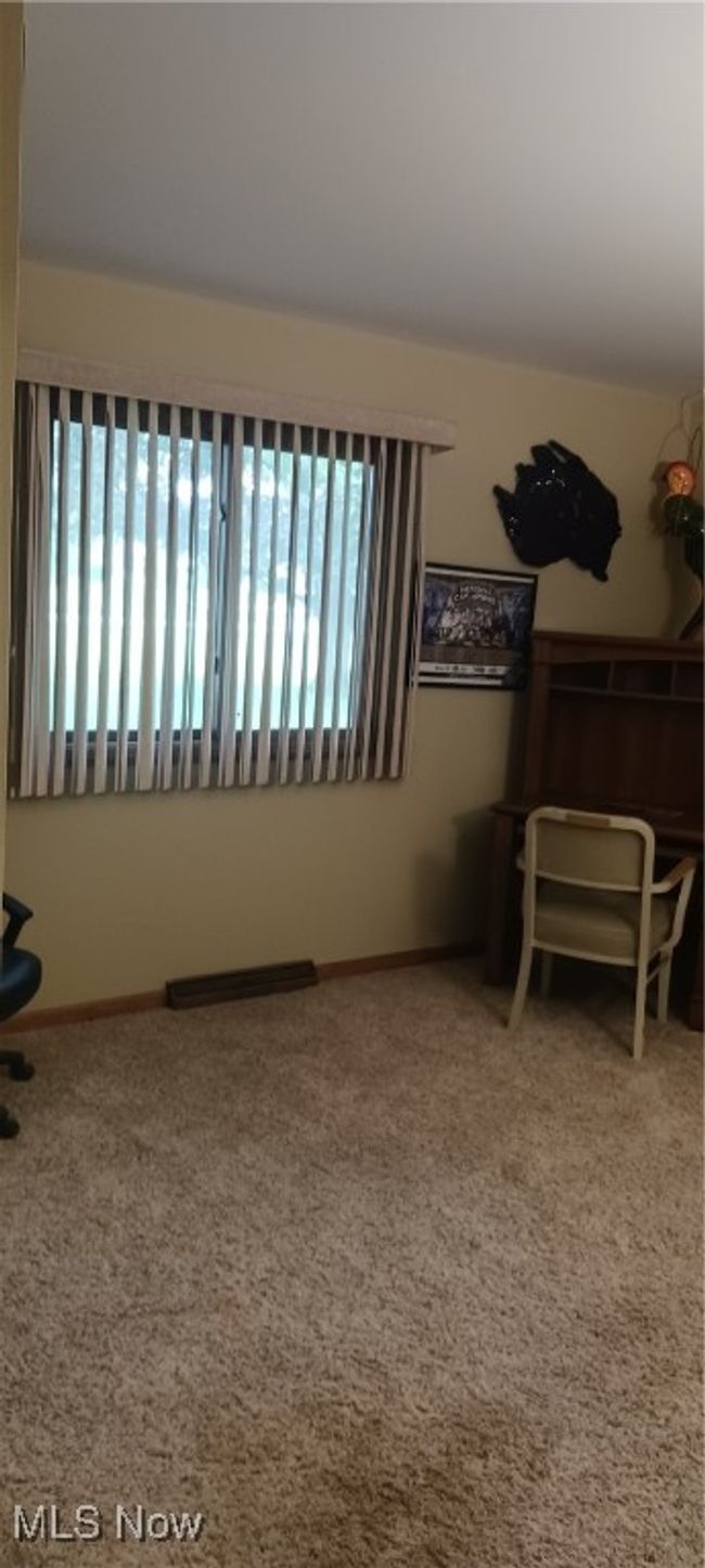 Unfurnished room with healthy amount of natural light and carpet | Image 9