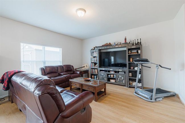 Spacious family room with laminate flooring. | Image 6
