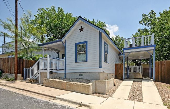 Te South side of the house has a one car covered carport with additional driveway for a second car. On street parking is allowed with no permit! | Image 23
