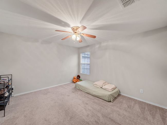 Unfurnished bedroom featuring carpet, baseboards, and ceiling fan | Image 27