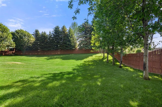 View of fenced backyard | Image 51