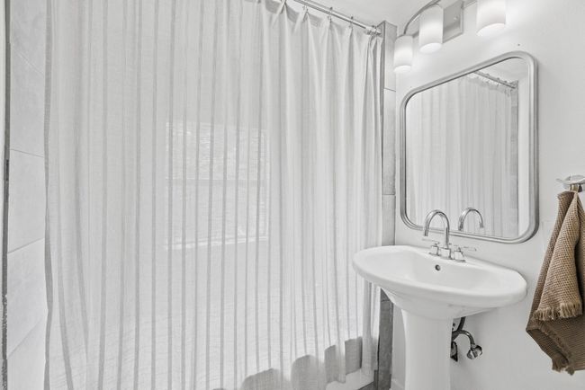 full Bathroom on the second floor with a sink | Image 19