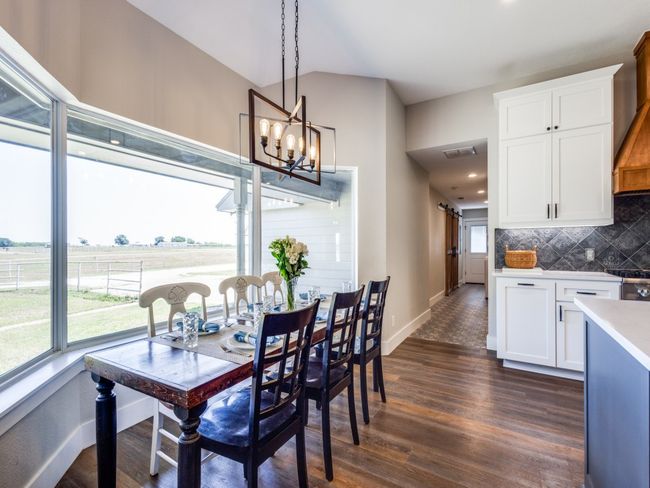 Best seat in the house overlooking the magnificent countryside. Hallway straight ahead leads to second living area, mud room, and laundry center. | Image 13