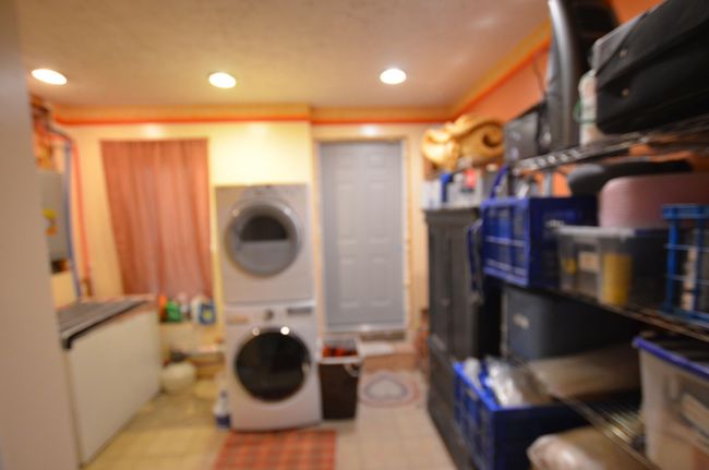 Shared washer/dryer in garage. There are also hook-ups in the main house, but seller chose to move her laundry room out here! | Image 49