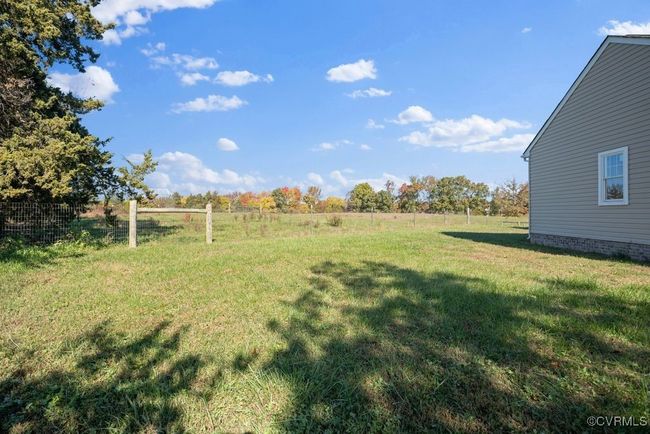 View of yard with fence and a rural view | Image 50