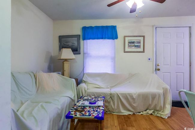 Bedroom featuring wood finished floors and a ceiling fan | Image 4