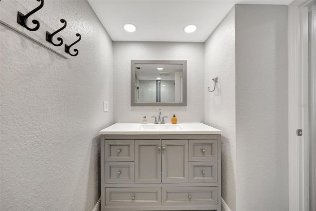 Bathroom 1 with beautiful vanity and mirro | Image 11