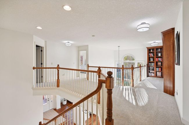Open staircase is flooded in natural light. | Image 33