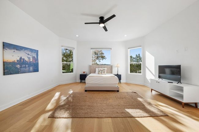 High-end interior features include two primary suites, with the master bedroom conveniently located on the main level. Enjoy soaring ceilings, recessed lighting, and an en-suite master retreat bath for ultimate comfort and luxury. | Image 17